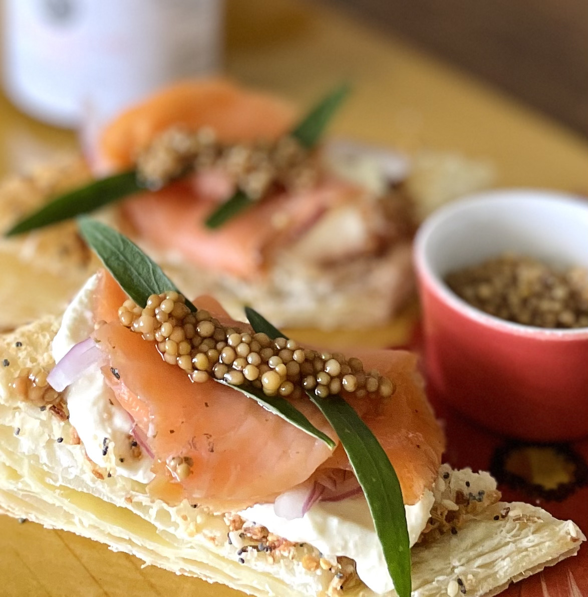 smoked salmon on puff pastry with pickled mustard seeds